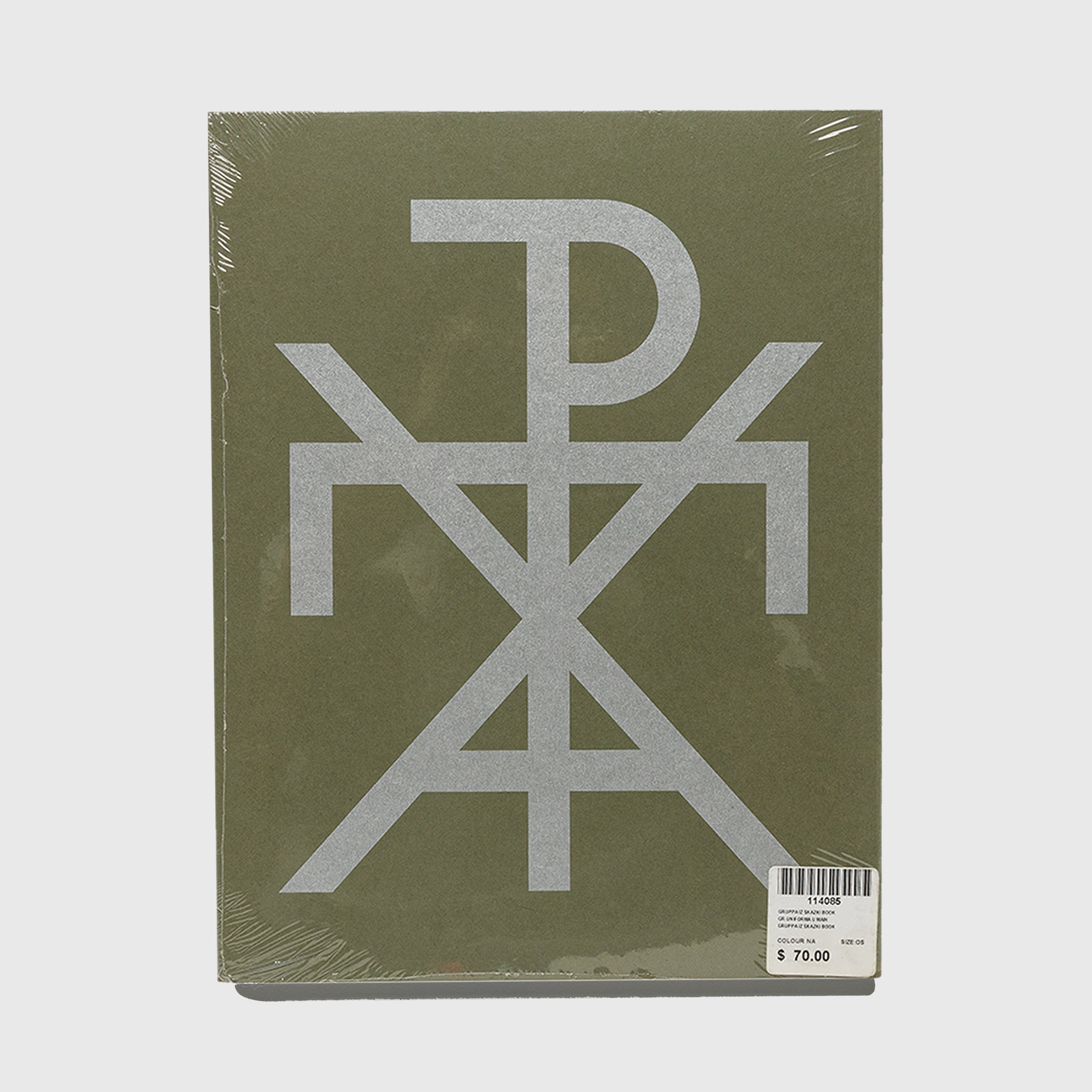 Green book with a gray symbol on the cover against a white background. Gosha Rubchinskiy GR Uniforma photography book.