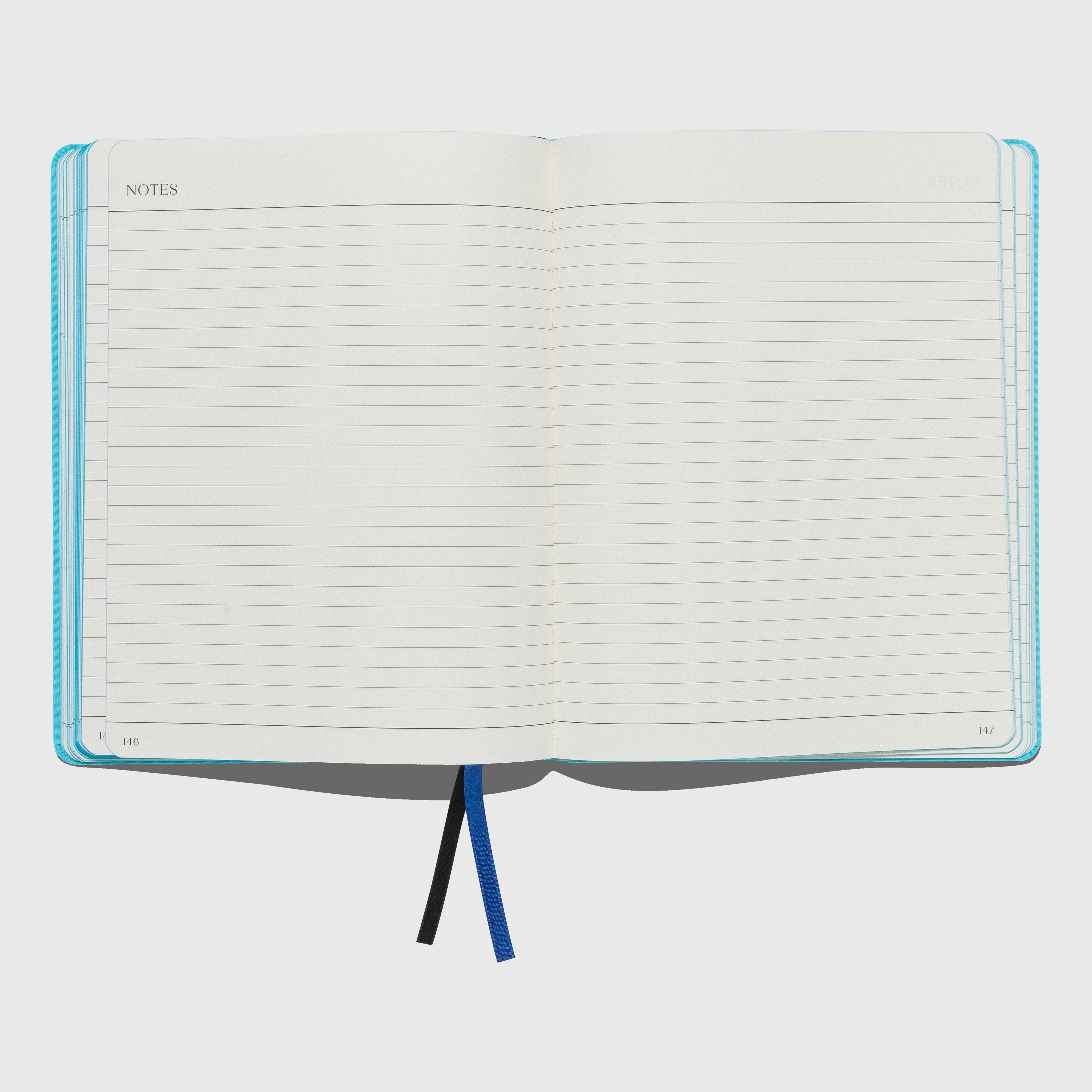 Open notebook with lined pages on a white background. The Important Flowers 2026 Planner by Sofia Coppola published by Mack.