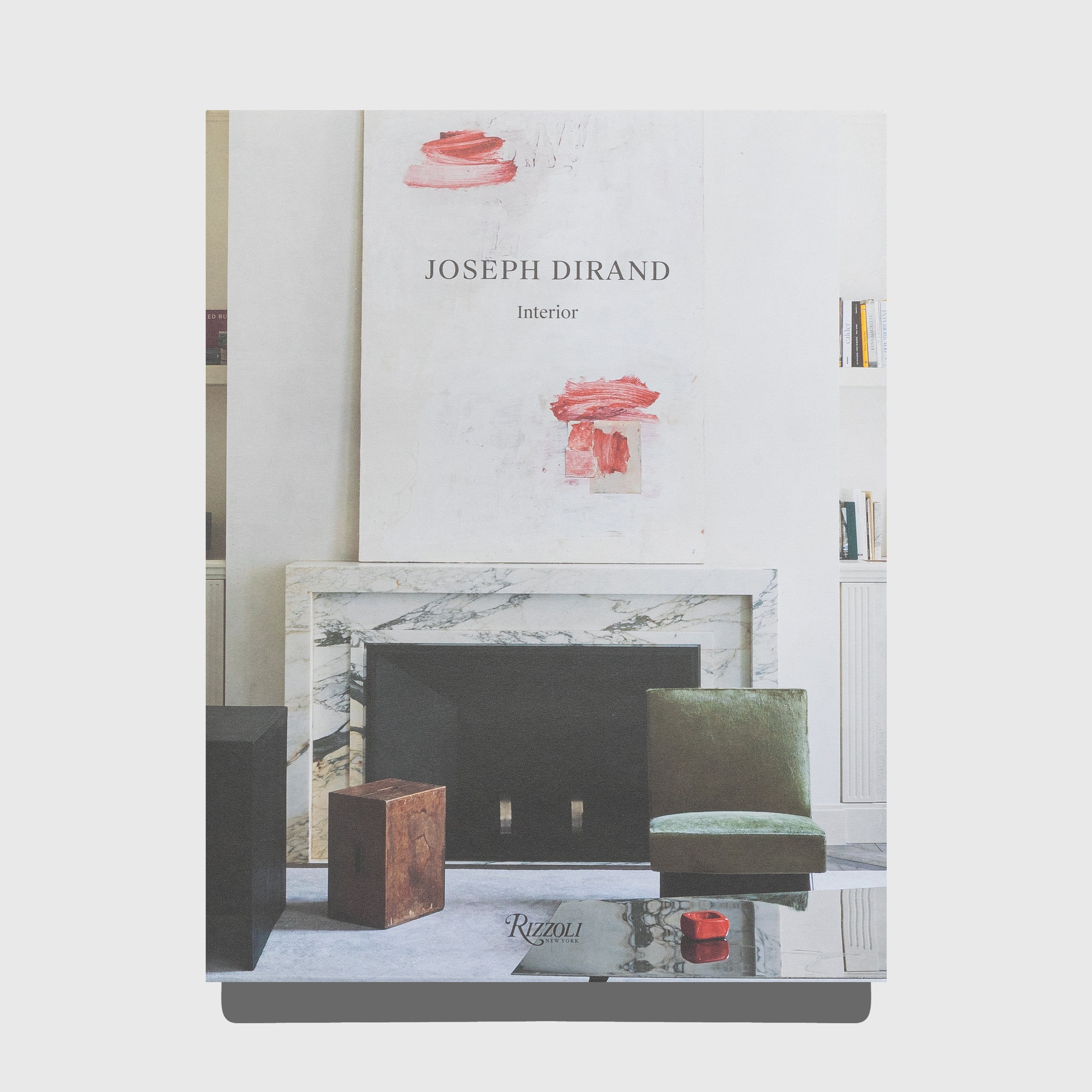 Book cover with interior design theme featuring a fireplace and decor items. Interior by Joseph Dirand. Published by Rizzoli.