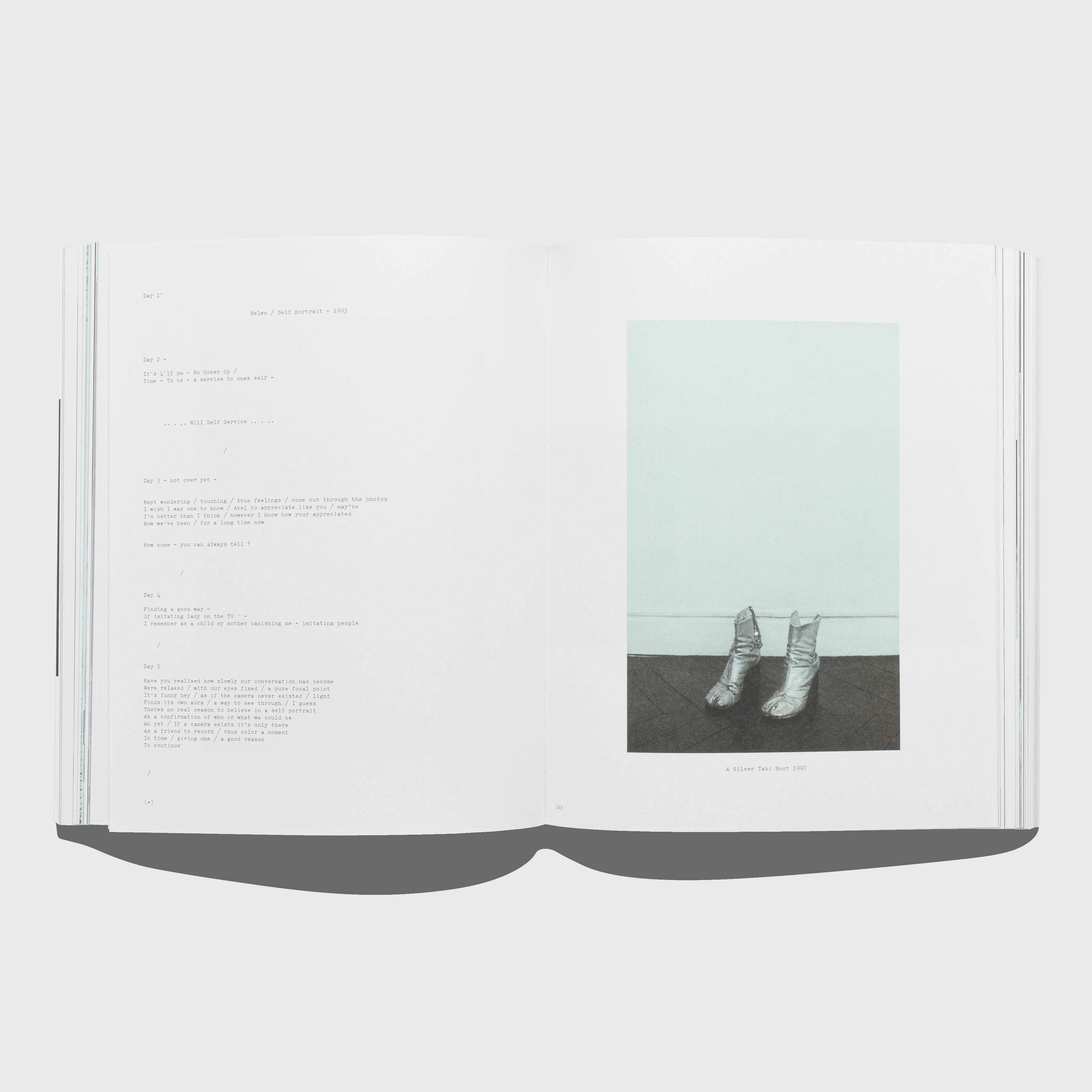 Open book with a photograph of silver Margiela tabi boots on a black surface. Out of Date book by Mark Borthwick. Published by Rizzoli.