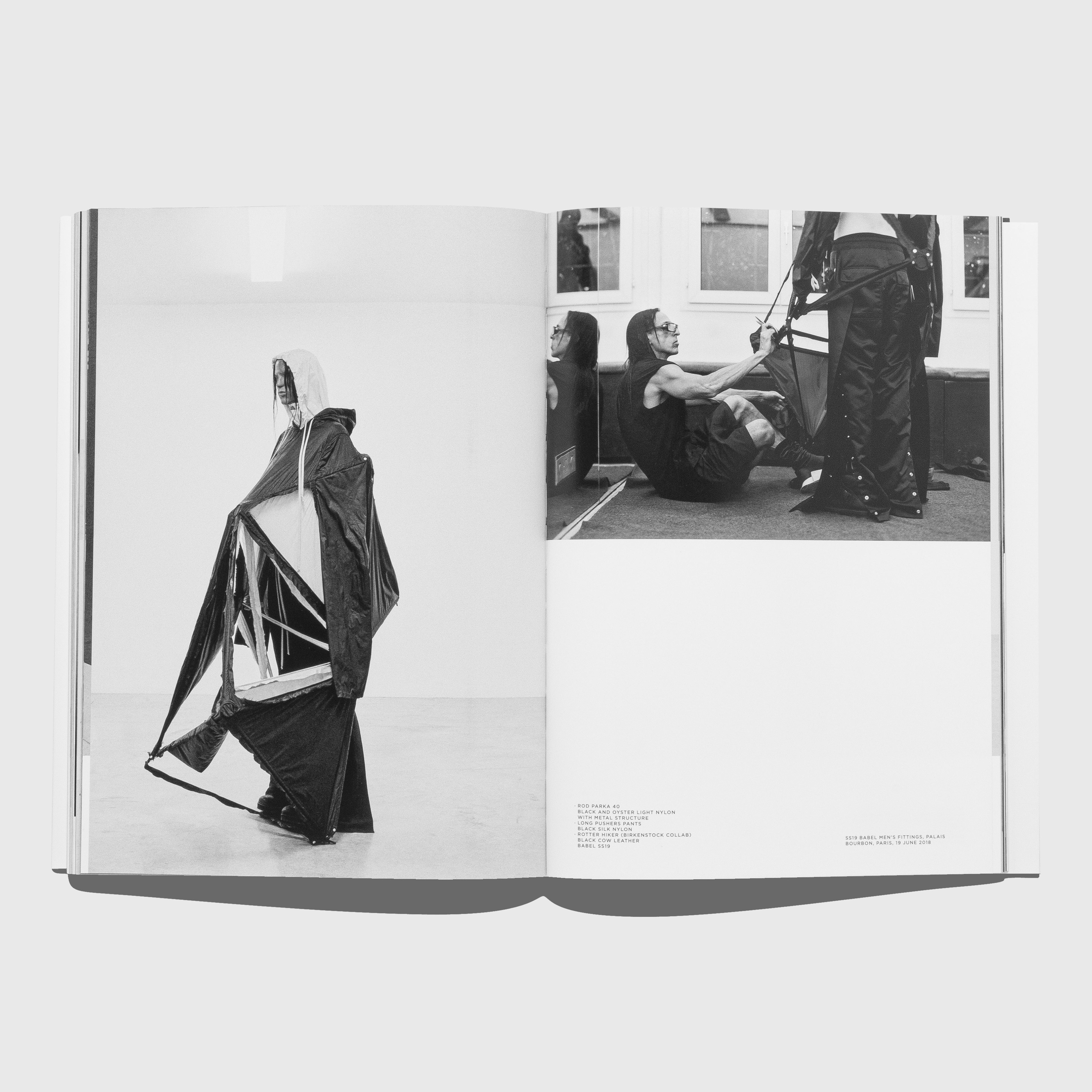 Open book showing black and white photographs of Rick Owens. Rick Owens Temple of Love book. Published by Rizzoli and Palais Galleria.