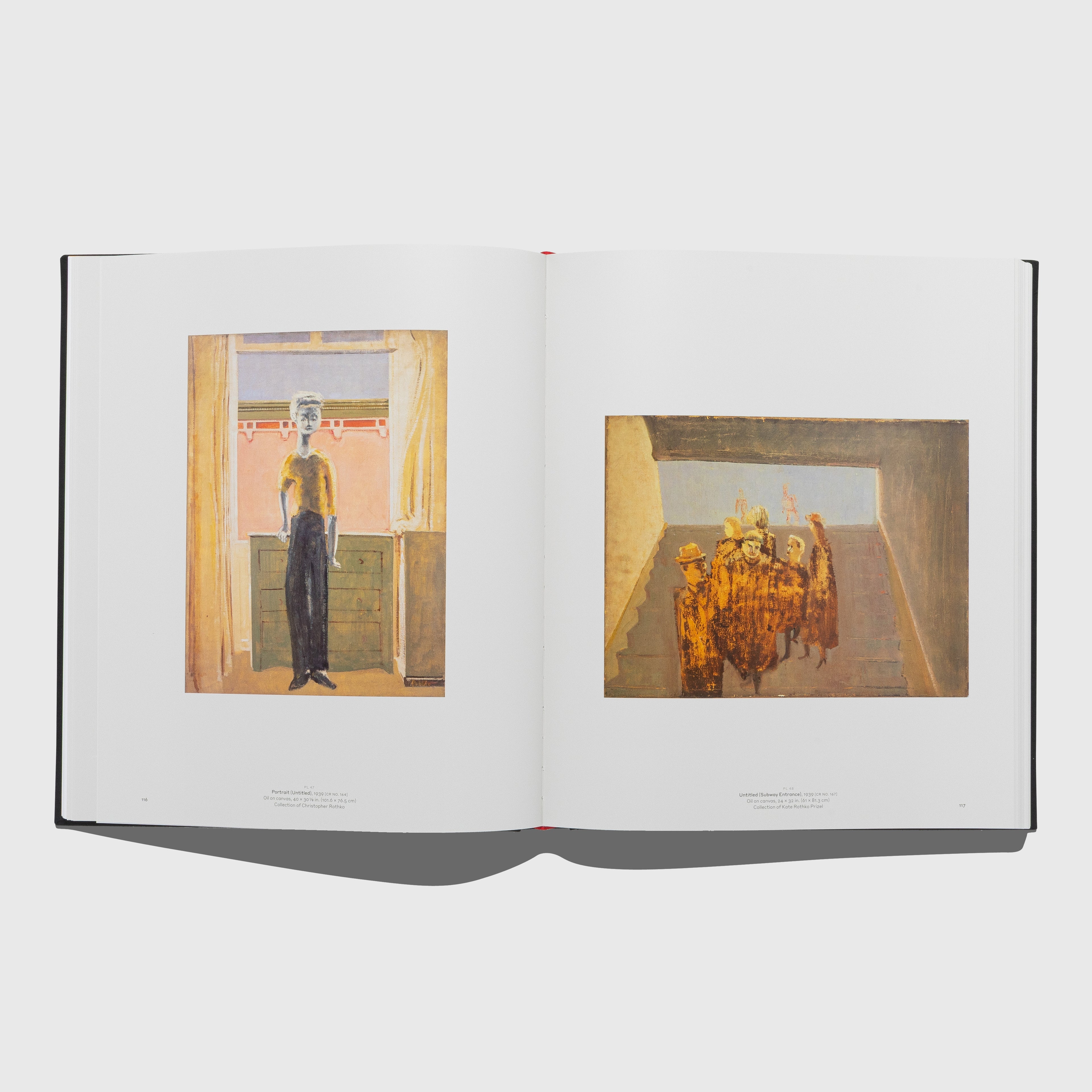 Open book showing two framed artworks on a white background. Mark Rothko art book published by Rizzoli Electa.