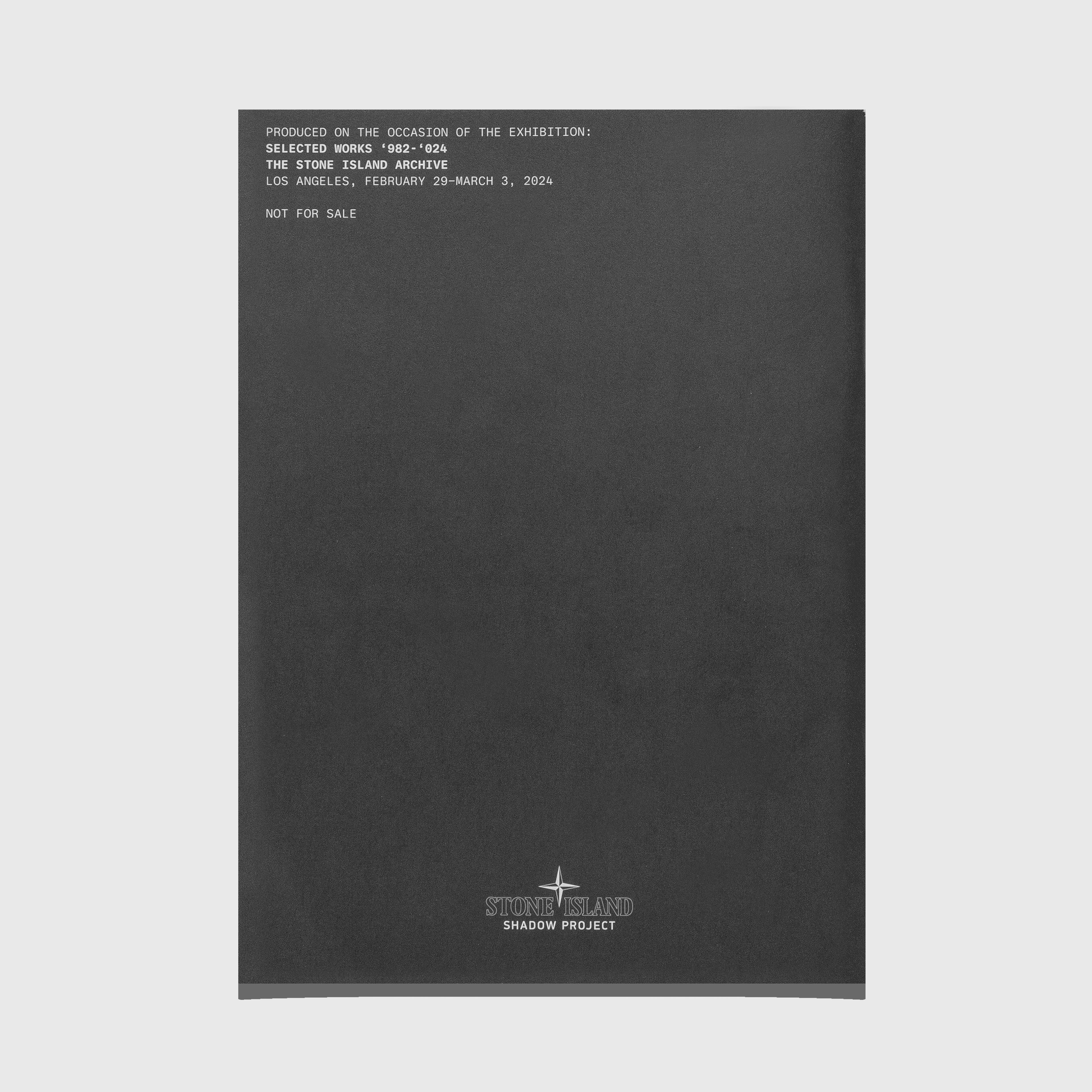 Black book with text and 'The Stone Island Shadow Project' logo on a white background Stone Island Shadow Project 2008-2020 by ACRONYM GMBH.